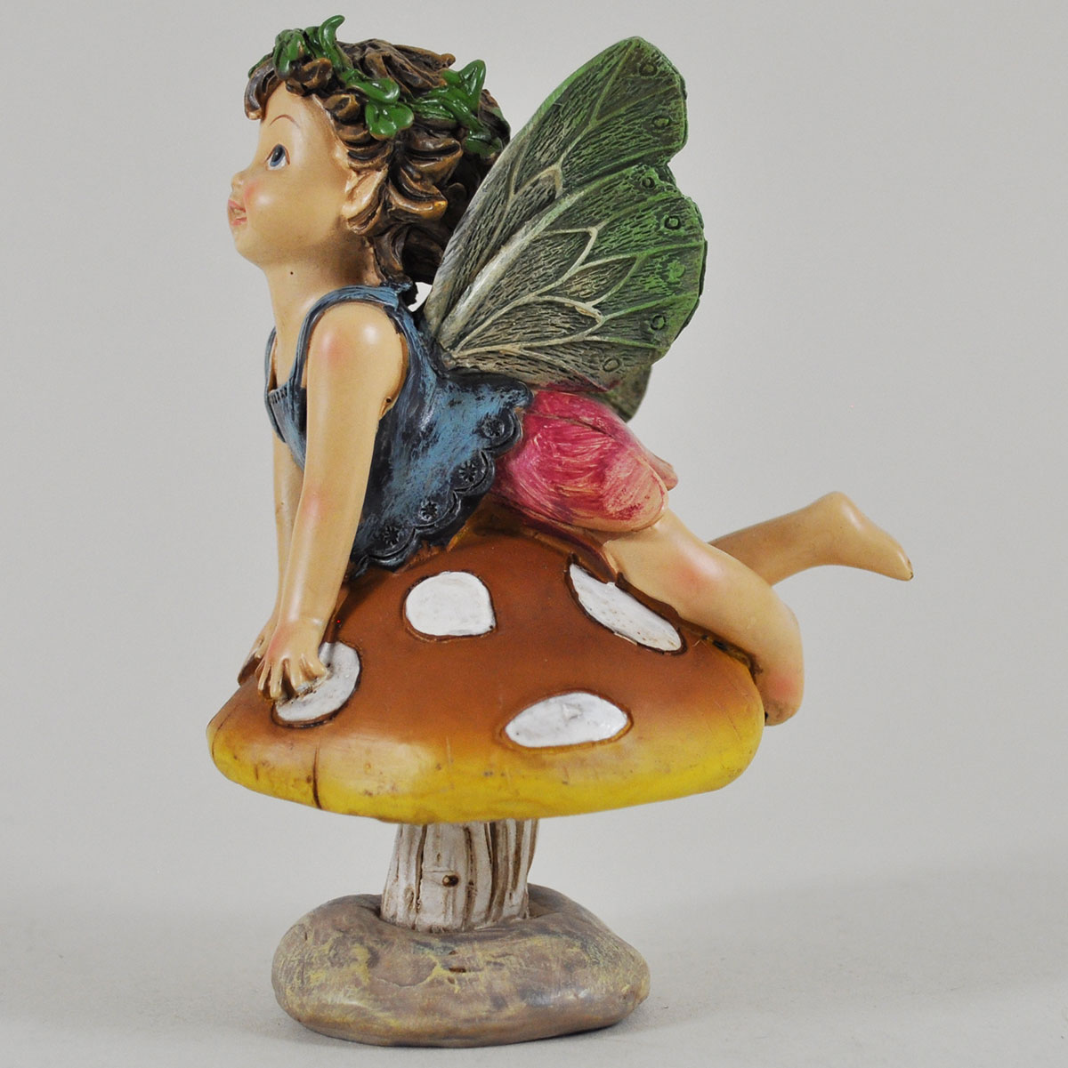 Flower Fairies sitting on mushroomfairygardensuk.co.uk